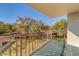 Private balcony with metal railing and views of lush landscaping at 2699 Seville Blvd # 303, Clearwater, FL 33764