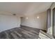 Bright bedroom with wood-look floors and double closets at 2699 Seville Blvd # 303, Clearwater, FL 33764