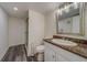 Updated bathroom with granite countertop, modern vanity and shower at 2699 Seville Blvd # 303, Clearwater, FL 33764