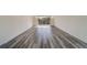 Spacious living room with wood-look flooring and lots of natural light at 2699 Seville Blvd # 303, Clearwater, FL 33764