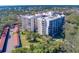 Aerial view of building highlighting its location and setting at 2699 Seville Blvd # 303, Clearwater, FL 33764