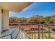 Relaxing balcony offering views of trees and parking area at 2699 Seville Blvd # 303, Clearwater, FL 33764