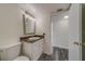 Bathroom with granite countertop, white vanity, and toilet at 2699 Seville Blvd # 303, Clearwater, FL 33764