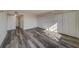 Bedroom with wood-look floors and ample closet space at 2699 Seville Blvd # 303, Clearwater, FL 33764