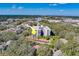 Aerial view of condo building showcasing its location and surrounding landscape at 2699 Seville Blvd # 303, Clearwater, FL 33764