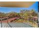 Spacious balcony with scenic views of nature and building amenities at 2699 Seville Blvd # 303, Clearwater, FL 33764