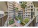 Lush courtyard with fountain and tropical landscaping at 2699 Seville Blvd # 303, Clearwater, FL 33764