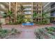 Ground level courtyard with fountain and tropical plants at 2699 Seville Blvd # 303, Clearwater, FL 33764