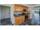 Kitchen with granite countertops and wood cabinets at 2699 Seville Blvd # 303, Clearwater, FL 33764