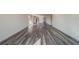 Living room showcasing a large open floor plan and hardwood-style flooring at 2699 Seville Blvd # 303, Clearwater, FL 33764
