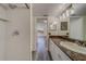 Bathroom features granite countertop and a walk-in shower at 2699 Seville Blvd # 303, Clearwater, FL 33764