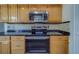 Kitchen boasts stainless steel appliances and dark granite countertops at 2699 Seville Blvd # 303, Clearwater, FL 33764