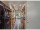Modern kitchen with wood cabinets, black appliances, and gray flooring at 2699 Seville Blvd # 303, Clearwater, FL 33764