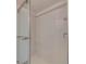 Walk-in shower with neutral tile and glass enclosure at 2699 Seville Blvd # 303, Clearwater, FL 33764