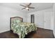 Bedroom with double bed, hardwood floors, ceiling fan, and access to closet and bathroom at 345 S Mcmullen Booth Rd # 142, Clearwater, FL 33759