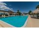 Relaxing community pool area with surrounding lounge chairs at 345 S Mcmullen Booth Rd # 142, Clearwater, FL 33759