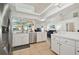 Bright kitchen with stainless steel appliances and white cabinets at 4936 Musselshell Dr, New Port Richey, FL 34655