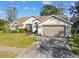 Single-Gathering home with two-car garage and landscaping at 4936 Musselshell Dr, New Port Richey, FL 34655