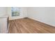 Bright living room featuring wood-look floors at 3455 Countryside Blvd # 52, Clearwater, FL 33761