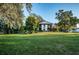 Condo building with lush landscaping and trees at 3455 Countryside Blvd # 52, Clearwater, FL 33761
