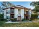 Two-story condo building with balconies and landscaping at 3455 Countryside Blvd # 52, Clearwater, FL 33761