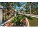 Community entrance with manicured landscaping and signage creates a welcoming atmosphere for Brooker Creek Villas and Townhomes at 4399 Brooker Creek Dr, Palm Harbor, FL 34685