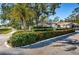 Community entrance with lush landscaping and signage, creating a welcoming first impression for prospective residents at 4399 Brooker Creek Dr, Palm Harbor, FL 34685