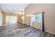 Spacious living room with wood floors, a fireplace, and natural light from the windows, creating a cozy atmosphere at 4399 Brooker Creek Dr, Palm Harbor, FL 34685