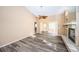 Open living area with wood flooring, ceiling fan and a fireplace, perfect for relaxing and enjoying natural light at 4399 Brooker Creek Dr, Palm Harbor, FL 34685