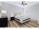 Cozy bedroom with a queen-size bed and wood-look floors at 517 Madeira St, Port Charlotte, FL 33953