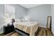Cozy bedroom with a double bed, nightstand, and large window at 517 Madeira St, Port Charlotte, FL 33953