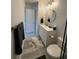 Clean and bright bathroom featuring a vanity, toilet, and shower at 330 Promenade Dr # 312, Dunedin, FL 34698