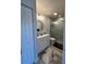 Modern bathroom with white vanity, updated fixtures, and a walk-in shower at 330 Promenade Dr # 312, Dunedin, FL 34698