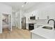 Modern kitchen with stainless steel appliances and white shaker cabinets at 1106 W La Salle St, Tampa, FL 33607