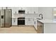 Modern kitchen with white shaker cabinets and stainless steel appliances at 1106 W La Salle St, Tampa, FL 33607