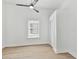 Bright bedroom with ceiling fan and wood-look flooring at 1106 W La Salle St, Tampa, FL 33607
