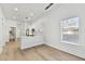 Modern kitchen with white cabinets, quartz countertops, and stainless steel appliances at 1106 W La Salle St, Tampa, FL 33607