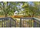 Private backyard with wooden deck and mature trees at 1106 W La Salle St, Tampa, FL 33607