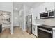 Modern kitchen with stainless steel appliances and white shaker cabinets at 1106 W La Salle St, Tampa, FL 33607