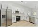 Modern kitchen with stainless steel appliances and white shaker cabinets at 1106 W La Salle St, Tampa, FL 33607