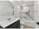 Bathroom with marble shower and quartz vanity top at 1106 W La Salle St, Tampa, FL 33607