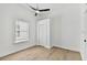 Bright bedroom with ceiling fan and wood-look flooring at 1106 W La Salle St, Tampa, FL 33607