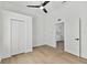 Bright bedroom with ceiling fan and wood-look flooring at 1106 W La Salle St, Tampa, FL 33607