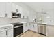 Modern kitchen with stainless steel appliances and white shaker cabinets at 1106 W La Salle St, Tampa, FL 33607