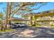 Covered parking with additional uncovered spots nearby at 57 Country Club Dr # 57, Largo, FL 33771