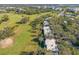 Aerial view of condo buildings near a golf course at 57 Country Club Dr # 57, Largo, FL 33771