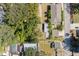 An overhead view showcasing multiple houses in a residential neighborhood with surrounding trees at 4204 N Marguerite St, Tampa, FL 33603