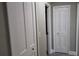 Hallway with white doors and gray walls at 5623 80Th St N # 510, St Petersburg, FL 33709