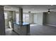 Open concept kitchen with granite island and stainless steel appliances at 5623 80Th St N # 510, St Petersburg, FL 33709