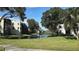 Residential buildings and lush trees along a canal at 5623 80Th St N # 510, St Petersburg, FL 33709